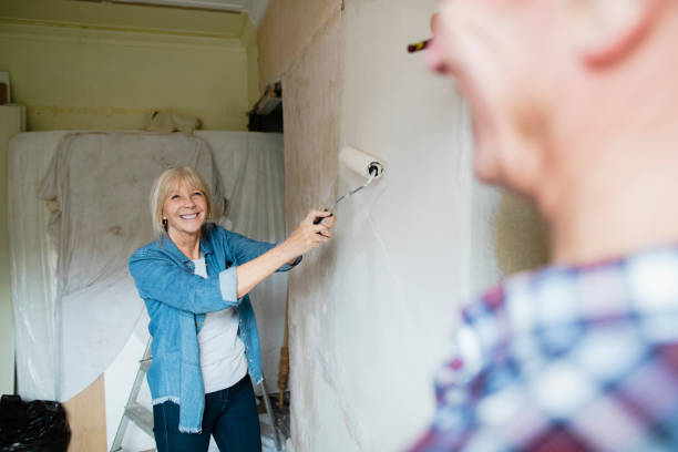 istock Painting With My Husband 1211385251