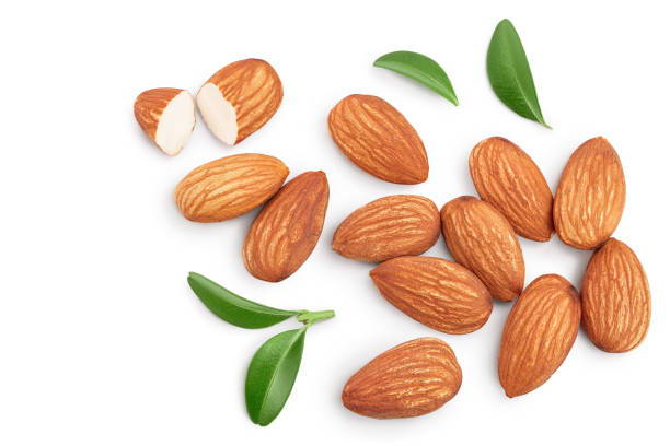 istock Almonds nuts with leaves isolated on white background with clipping path and full depth of field. Top view. Flat lay 1211386596
