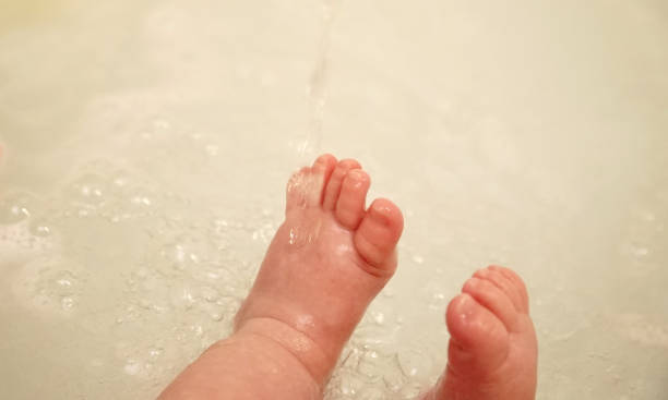 Cute little feet of newborn baby