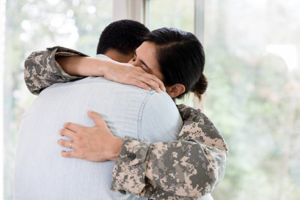 istock Upset soldier hugging husband 1211388284