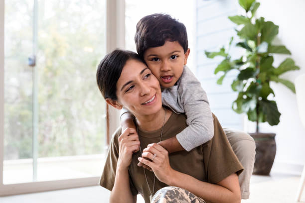 istock Little boy enjoys time with his soldier mom 1211388323