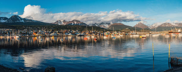 Ushuaia cityscape at sunset - Patagonia, Argentina Ushuaia cityscape at sunset - Patagonia, Argentina. View from the harbor. tierra del fuego national territory stock pictures, royalty-free photos & images