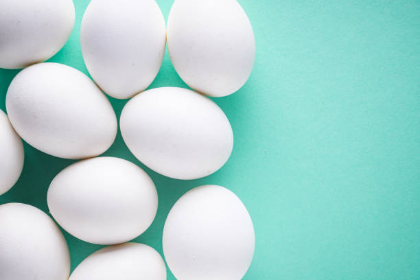istock white chicken eggs on green pastel background 1211388997