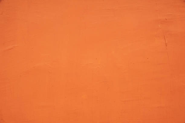istock Surface of orange plaster on the wall 1211392110