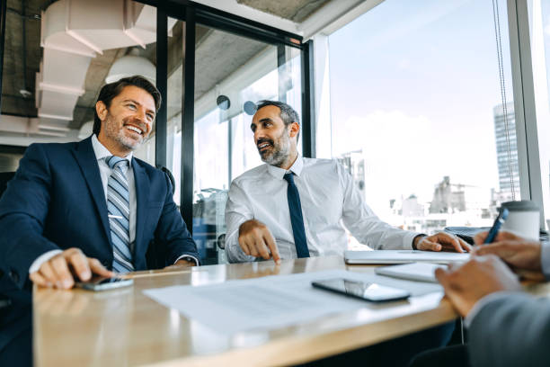 istock Business partners having discussion in office room 1211392124