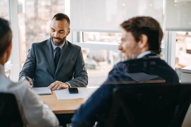 istock Business partners discussing business strategy in office 1211392754