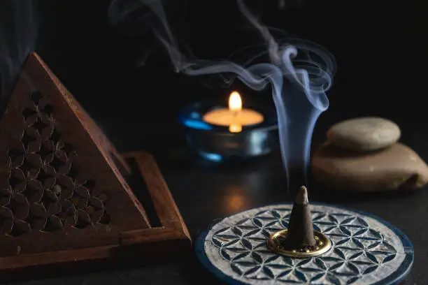 Several incense cones lit