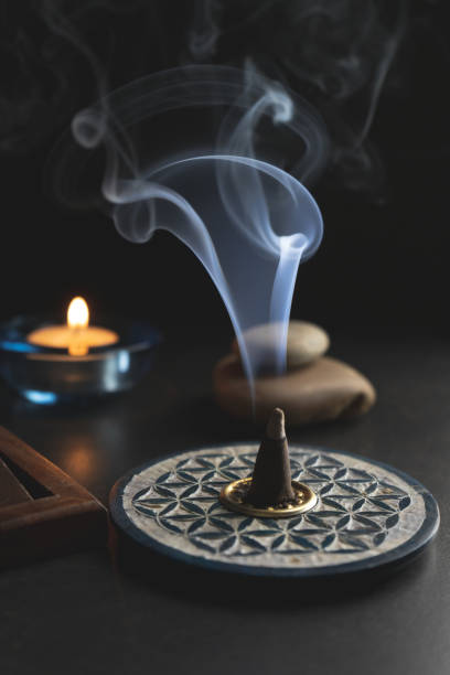 istock Thick smoke coming out of an incense cone 1211399100