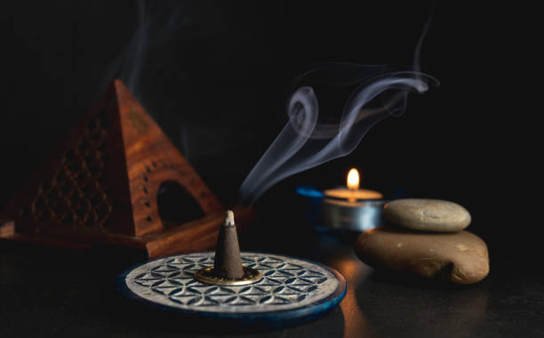 istock Background with incense lit and a candle lit 1211399106