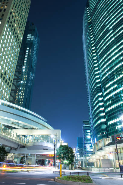 skyline of skyscrapers at shiodome area in shimbashi district, tokyo - shiodome urban scene blurred motion tokyo prefecture imagens e fotografias de stock