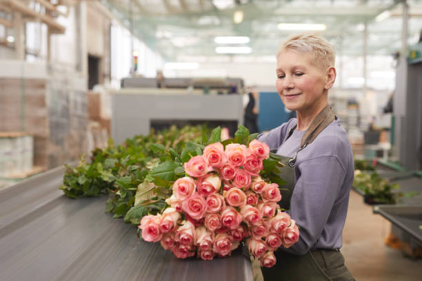 istock Woman with roses in warehouse 1211405082