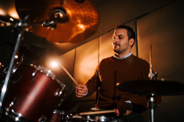 istock Low angle image of a drummer playing indoors. 1211406620
