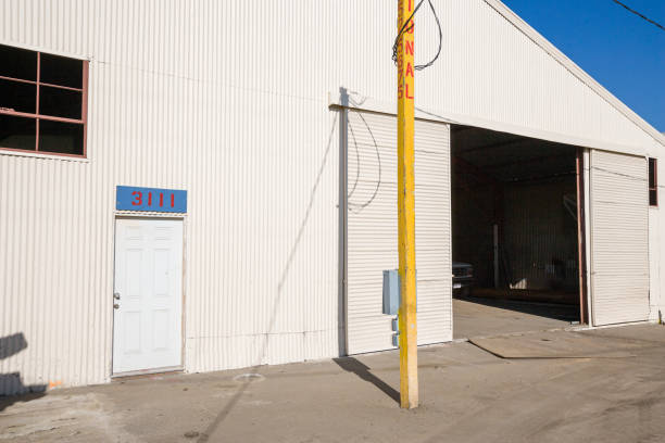 istock Empty renovation outside view of a construction site warehouse for an office building 1211406807