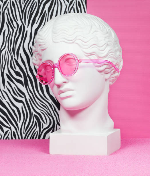 istock Plaster head sculpture with pink eyeglasses 1211407172