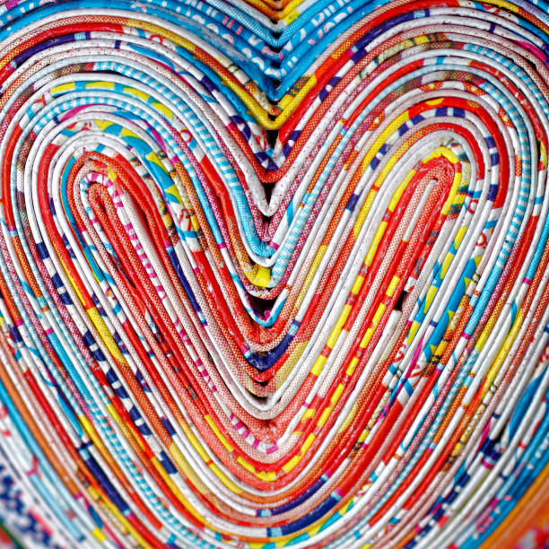 сердце - abstract newspaper macro heart shape стоковые фото и изображения