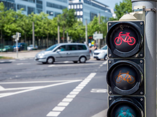 istock Bicycle traffic light points to red in traffic 1211408284