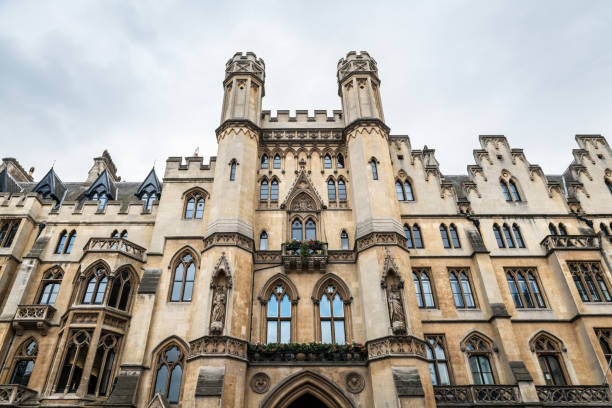 Westminster School in London Low-angle view of the entrance to Dean’s Yard and Westminster School as seen from Victoria Street in London. university of london photos stock pictures, royalty-free photos & images