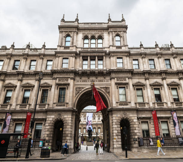 The Royal Academy of Arts, London Incidental people and sculpture exhibit outside the Royal Academy of Arts, an art institution currently based in Burlington House in London. burlington house stock pictures, royalty-free photos & images