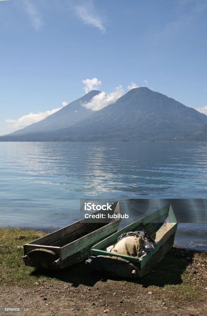 Traditional wooden boats by Lake Atitlan in Guatemala  At The Edge Of Stock Photo