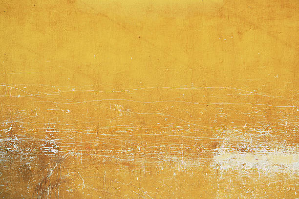 Yellow wall texture from old town Antigua in Guatemala stock photo