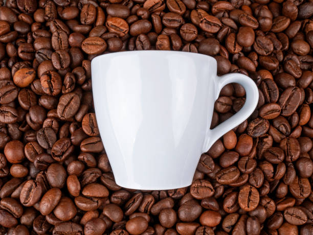 istock Cup of coffee on coffee beans 1211413803