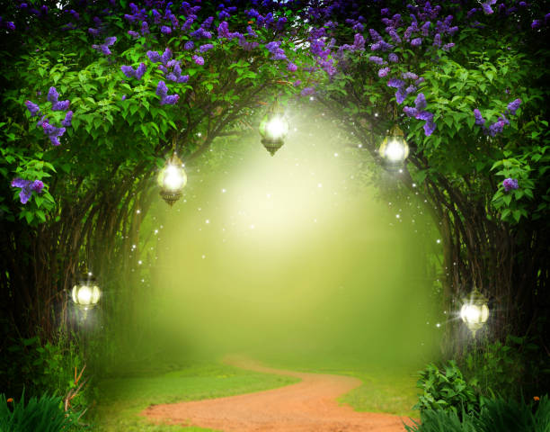 istock Fantasy  background . Magic forest with road.Beautiful spring  landscape.Lilac trees in blossom 1211414879