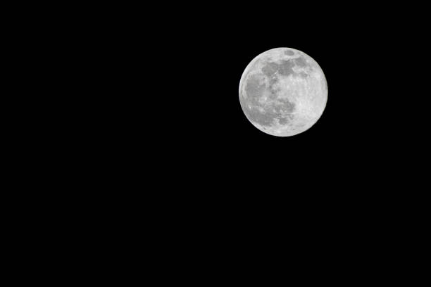 istock in the night sky the full moon shines 1211415006