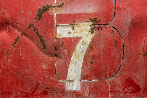 istock Numbers on an old rusty metal background. Texture of old paint and rust on the numbers 1211418219