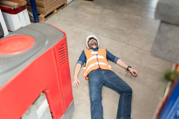 istock Fainted Hispanic Worker By Forklift At Factory 1211420393