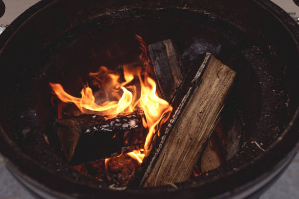 istock Burning firewood in a round pot. 1211421076