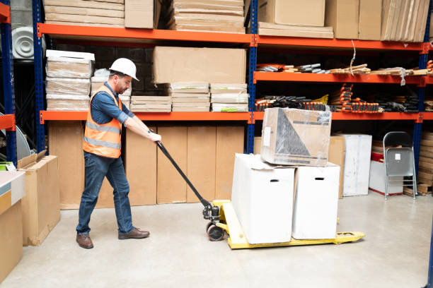istock Side View Of Latin Worker Taking Care Of Merchandise 1211421164