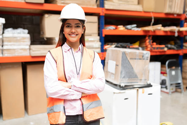 istock Confident Female Supervisor In Protective Workwear At Factory 1211421663