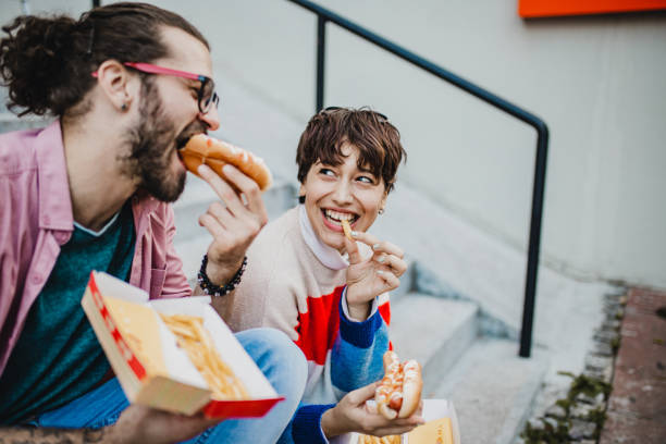 istock Couple eating fast food 1211423850