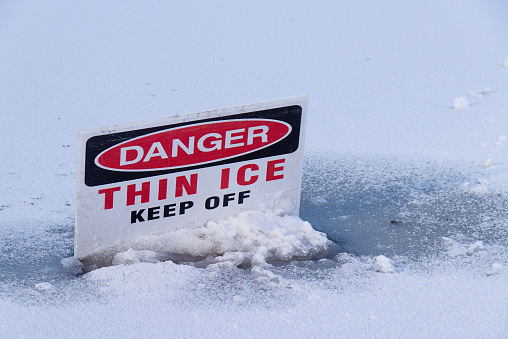 View of sign on a frozen lake in Vancouver. 