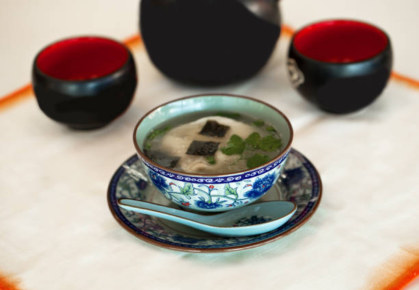 istock Chinese soup with prawns and vegetabla into blue bowl 1211428796