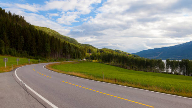 istock Road curve at mountain forest nature landscape 1211429634