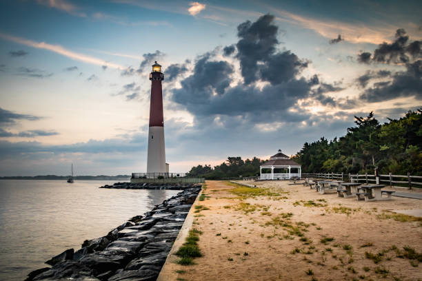 Dawn at the seashore with Barnegat Lighthouse in the background stock photo