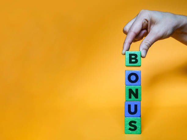 istock BONUS word made with building blocks. 1211433275