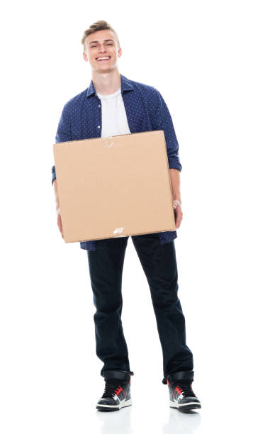 adolescentes caucásicos de pie frente al fondo blanco usando el botón hacia abajo camisa y sosteniendo cartón - box men holding isolated fotografías e imágenes de stock