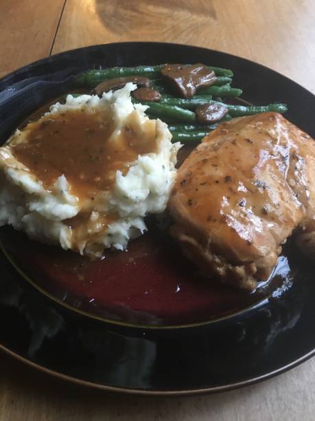 istock Mouth-Watering Chicken Dinner with Mashed Potatoes and Gravy 1211434441