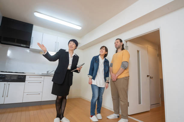 Real estate agent showing customers an apartment