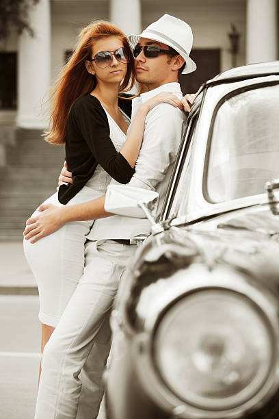 istock Young couple with a retro car 121143851