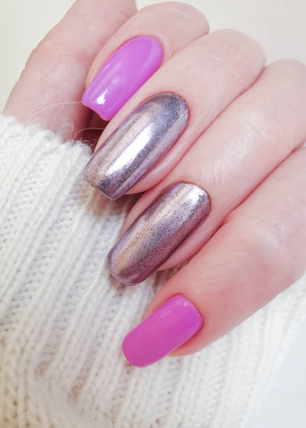 istock female hand beautiful manicure sweater 1211438925
