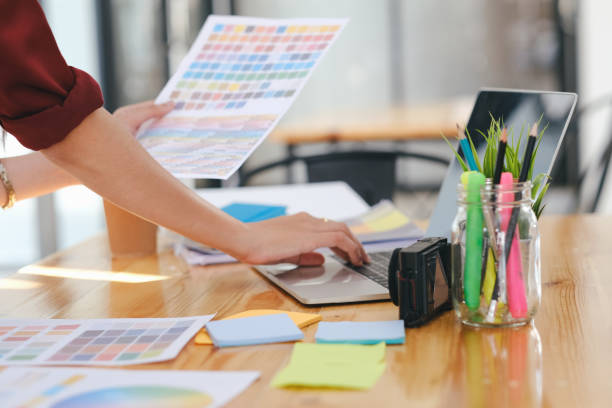 istock Young photographer and graphic designer at work in office. 1211439089