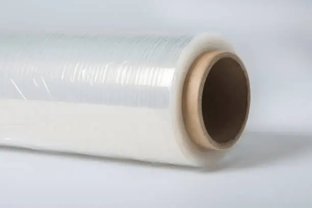 Roll of wrapping plastic stretch film on white background with clipping path