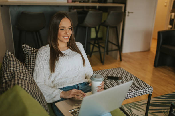 istock Young woman freelancer working from home 1211443438