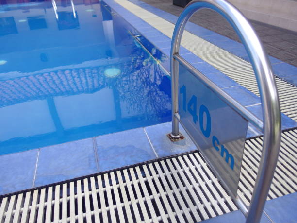 istock Blue swiming pool with clear clean fresh water 1211443469