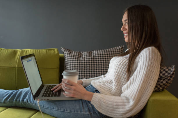 istock Young woman freelancer working from home 1211443503
