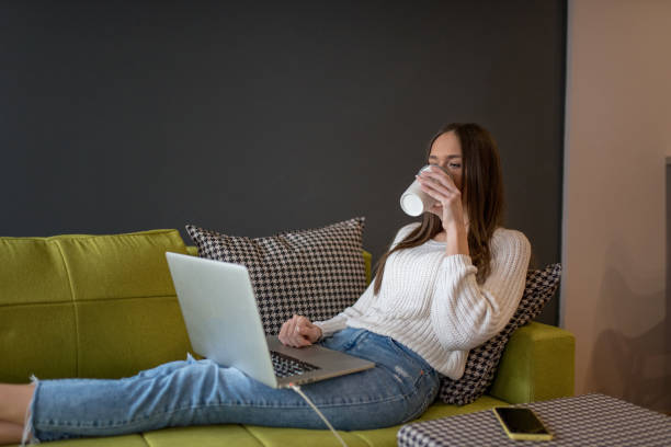 istock Young woman freelancer working from home 1211443608