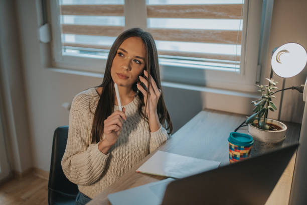 istock Young woman freelancer working from home 1211443699